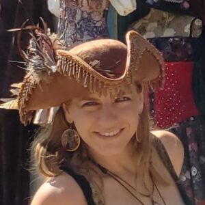 Woman In Brown Beaded Hat