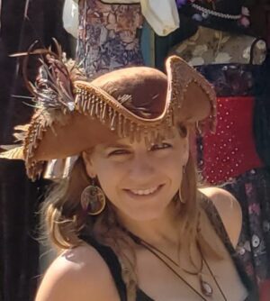 Woman In Brown Beaded Hat