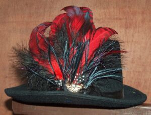 Red and black feather hat